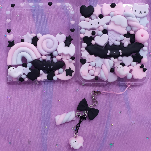 Pastel goth kawaii decoden phone case for Galaxy Z Flip 7, 6, 5, 4 with bats, rainbows, candy and star charms, handmade in pink, lilac and black.