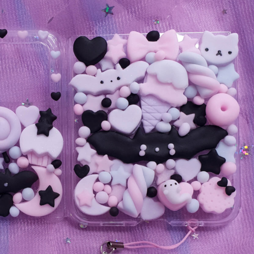 Pastel goth kawaii decoden phone case for Galaxy Z Flip 7, 6, 5, 4 with bats, rainbows, candy and star charms, handmade in pink, lilac and black.