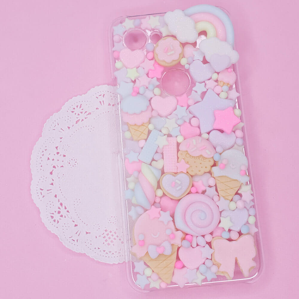 Handmade kawaii decoden phone case with pastel sweets, ice cream, cookies, and stars