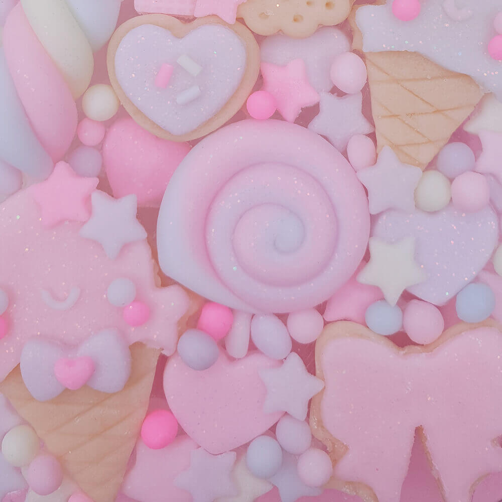 Handmade kawaii decoden phone case with pastel sweets, ice cream, cookies, and stars