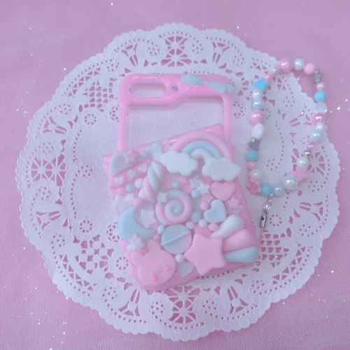 Pastel pink and blue kawaii decoden phone case with rainbow, clouds, stars and pearl charm strap Pastel pink and blue kawaii decoden phone case with rainbow, clouds, stars and pearl charm strap