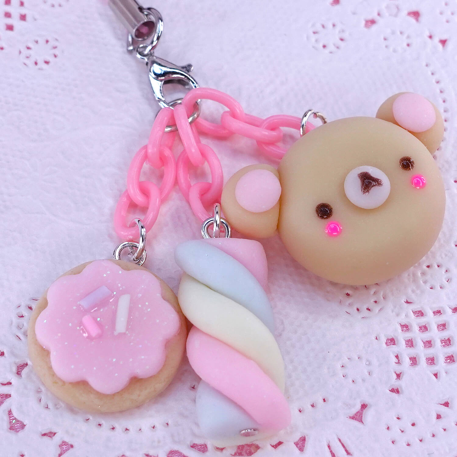 Handmade kawaii phone strap with pastel bear, marshmallow, and cookie charm in polymer clay