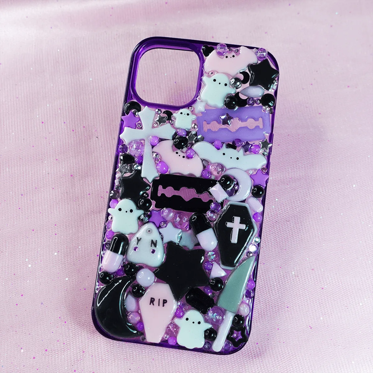 Jirai Kei Yami Kawaii decoden phone case with purple, pink and black gothic charms and cute ghost decorations